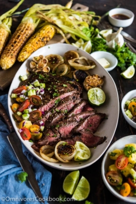 This recipe shares the secrets to creating the tenderest marinated flank steak that is bursting with flavor; included are salad and side dish ideas for an inexpensive dinner party.