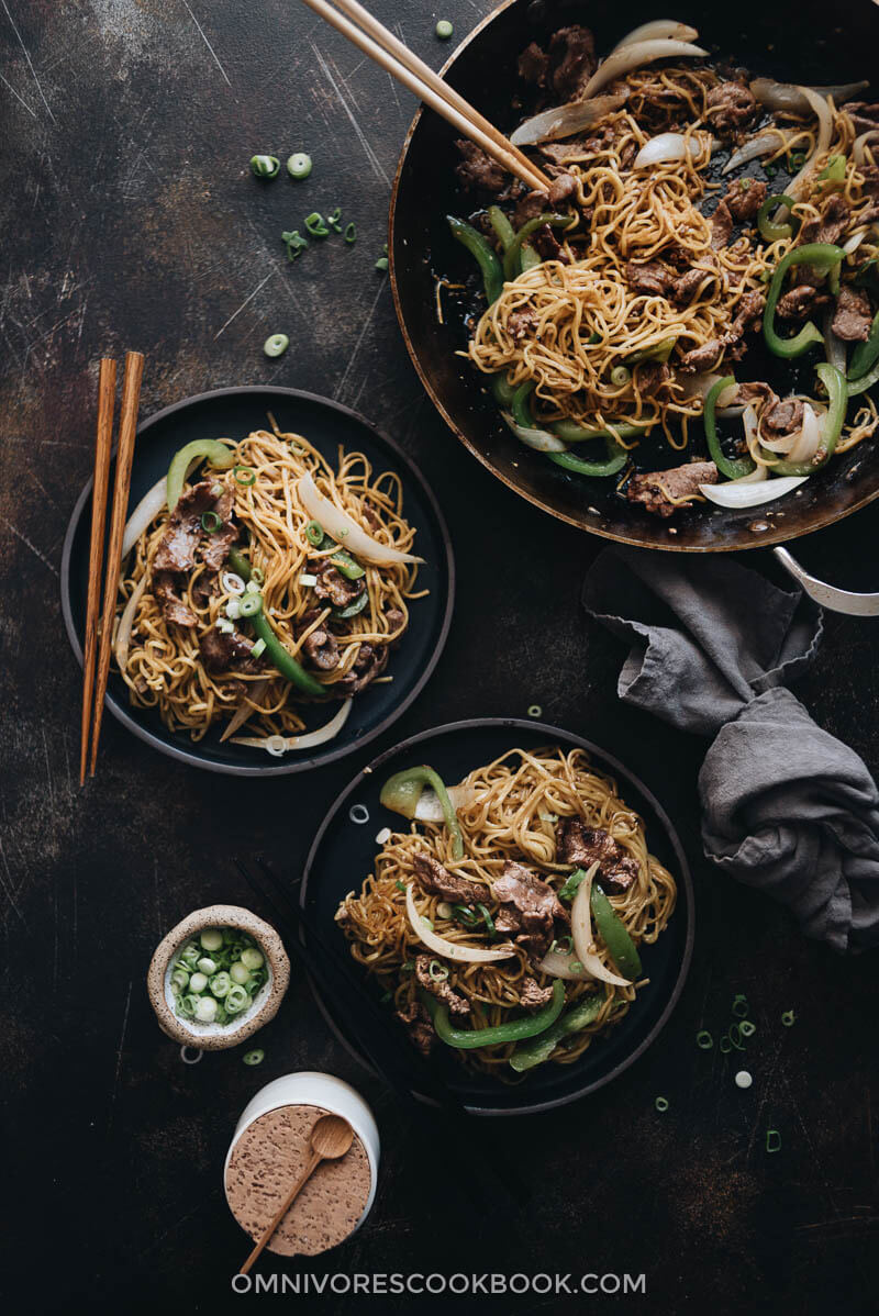Homemade beef chow mein in skillet and served in plates