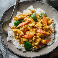 Bring takeout taste home by making Chinese curry chicken in your kitchen. It’s brimming with tender chicken and crispy veggies in a cheerful bright yellow curry sauce. {Gluten-Free Adaptable}
