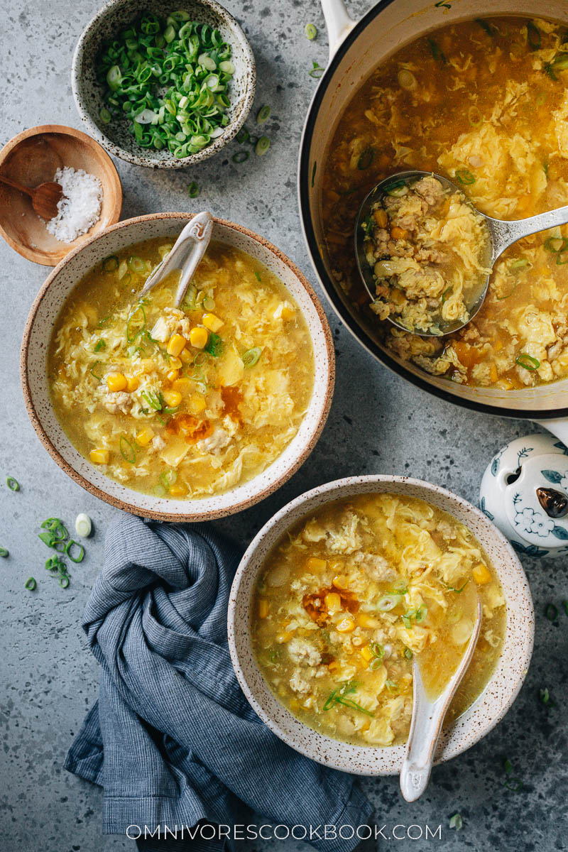 Chinese corn soup with chicken served in bowls